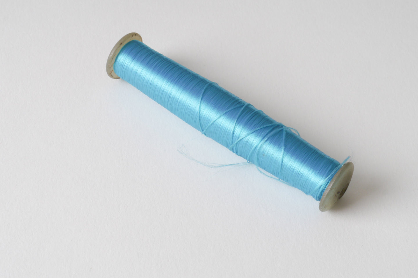 Spoel met inslaggaren voor passement