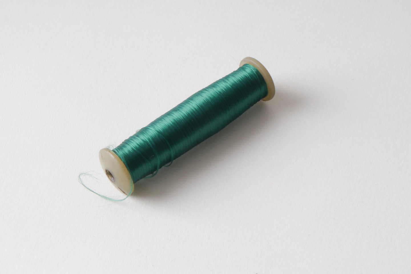 Spoel met inslaggaren voor passement