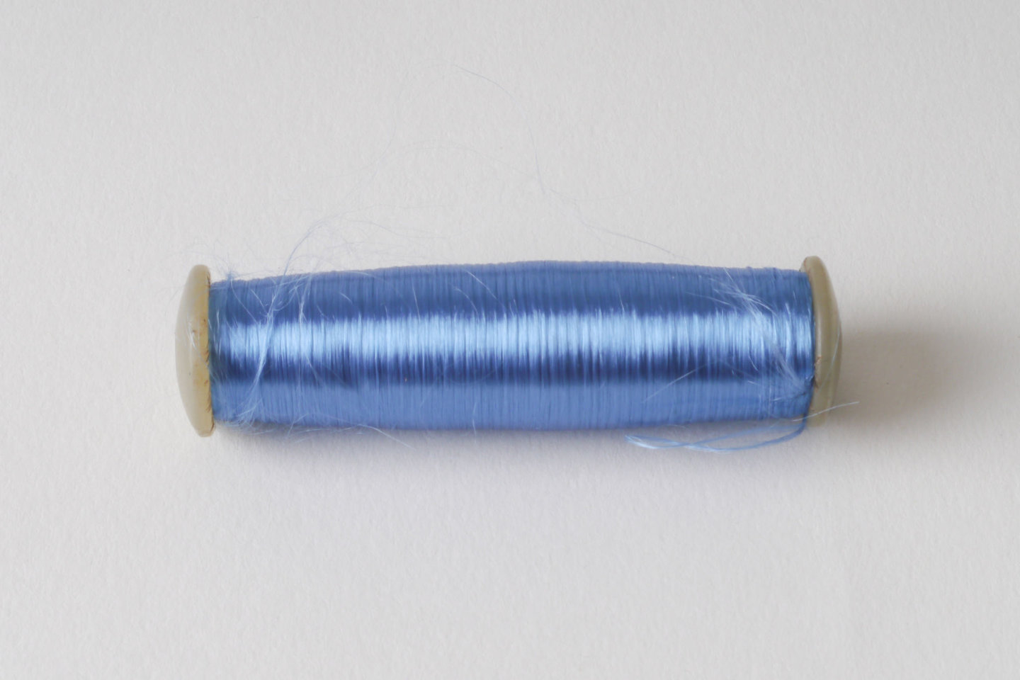 Spoel met inslaggaren voor passement