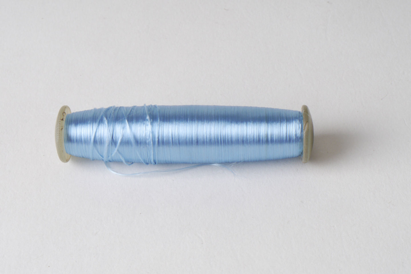 Spoel met inslaggaren voor passement