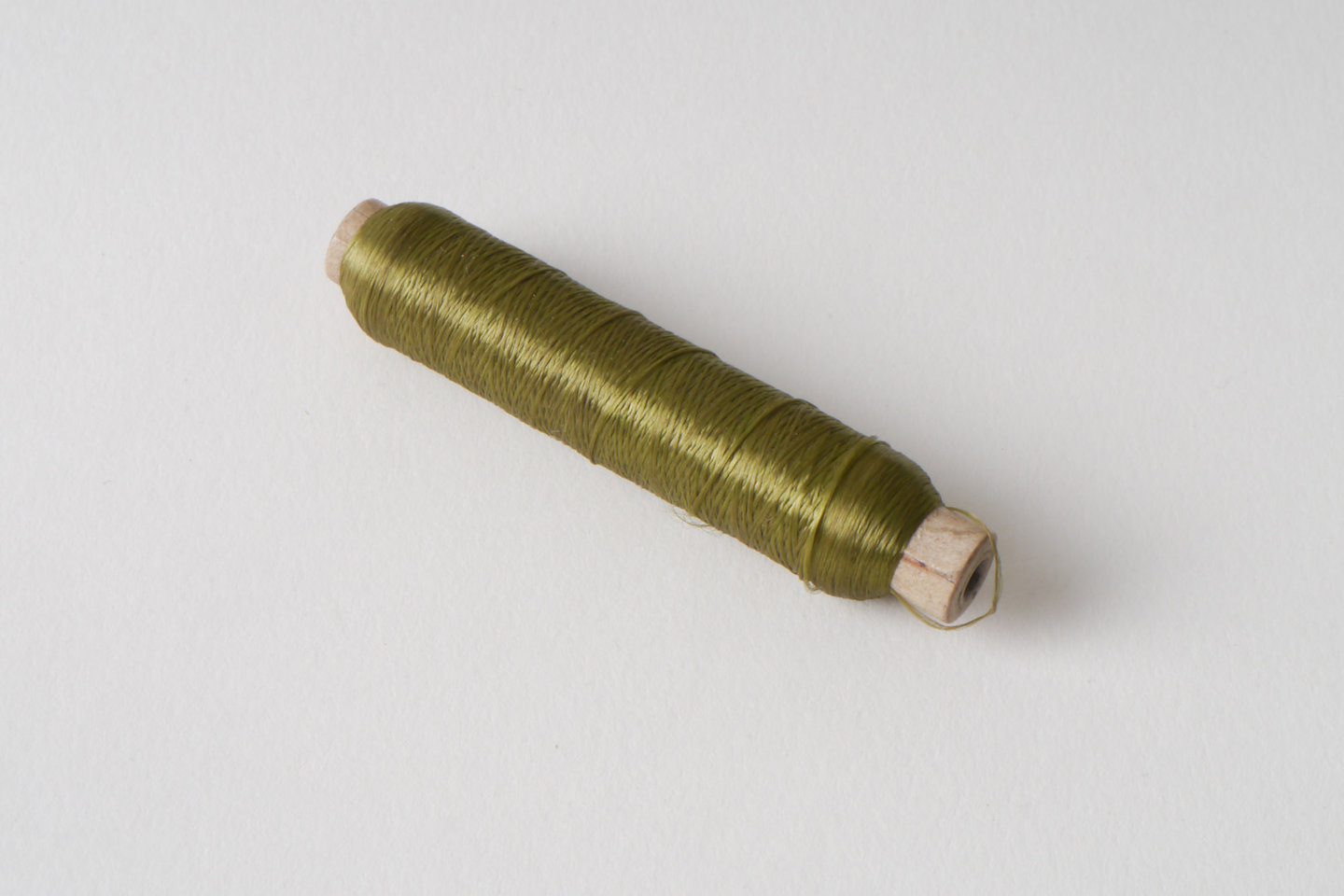 Spoel met inslaggaren voor passement