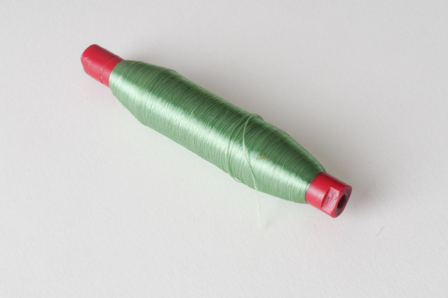 Spoel met inslaggaren voor passement