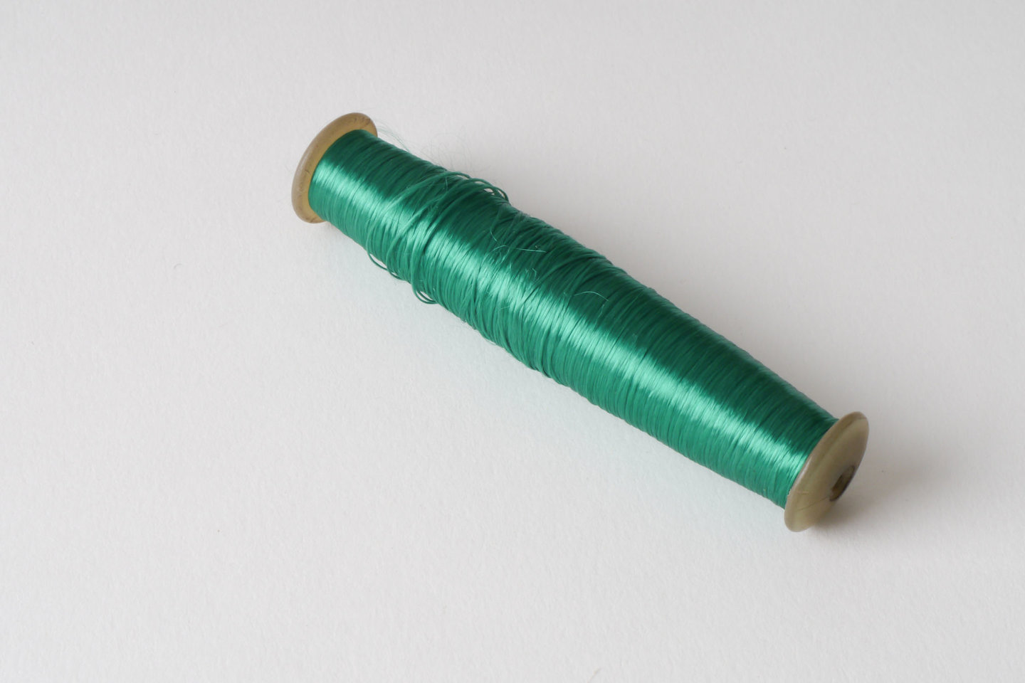 Spoel met inslaggaren voor passement