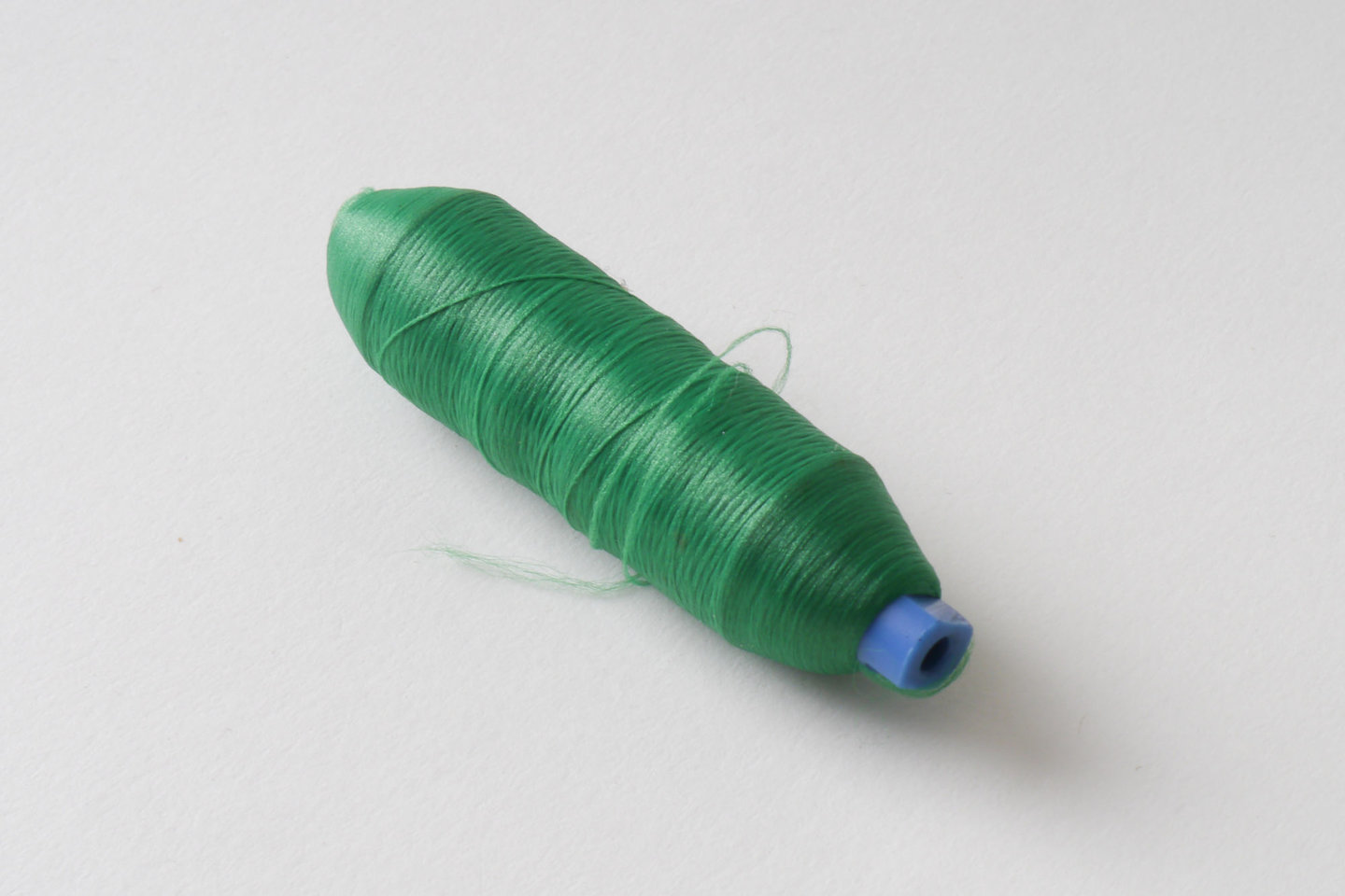 Spoel met inslaggaren voor passement