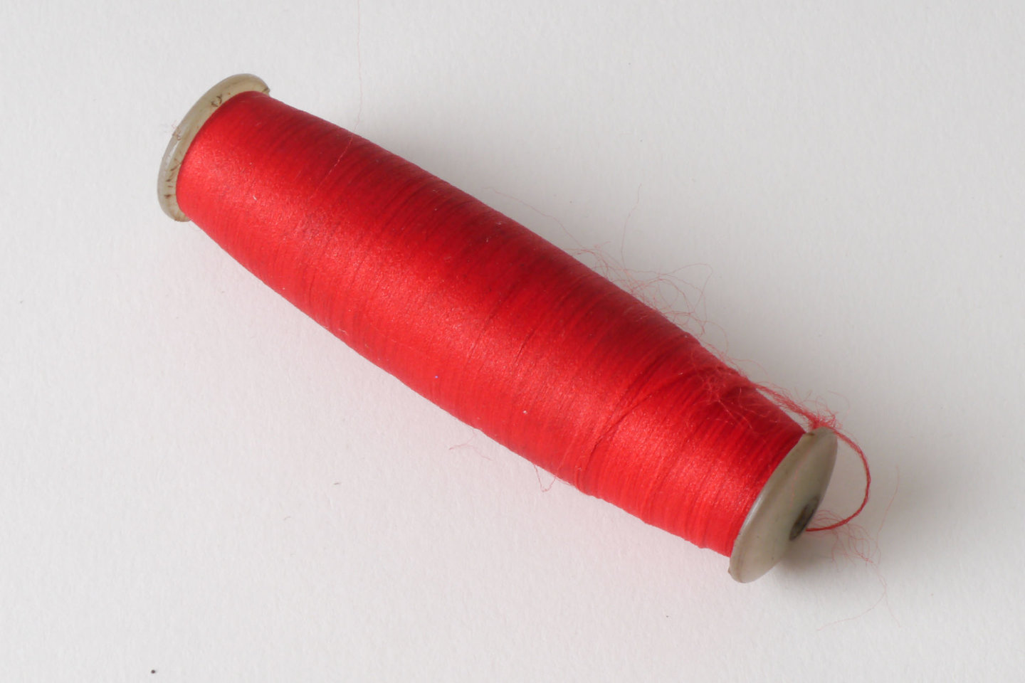 Spoel met inslaggaren voor passement