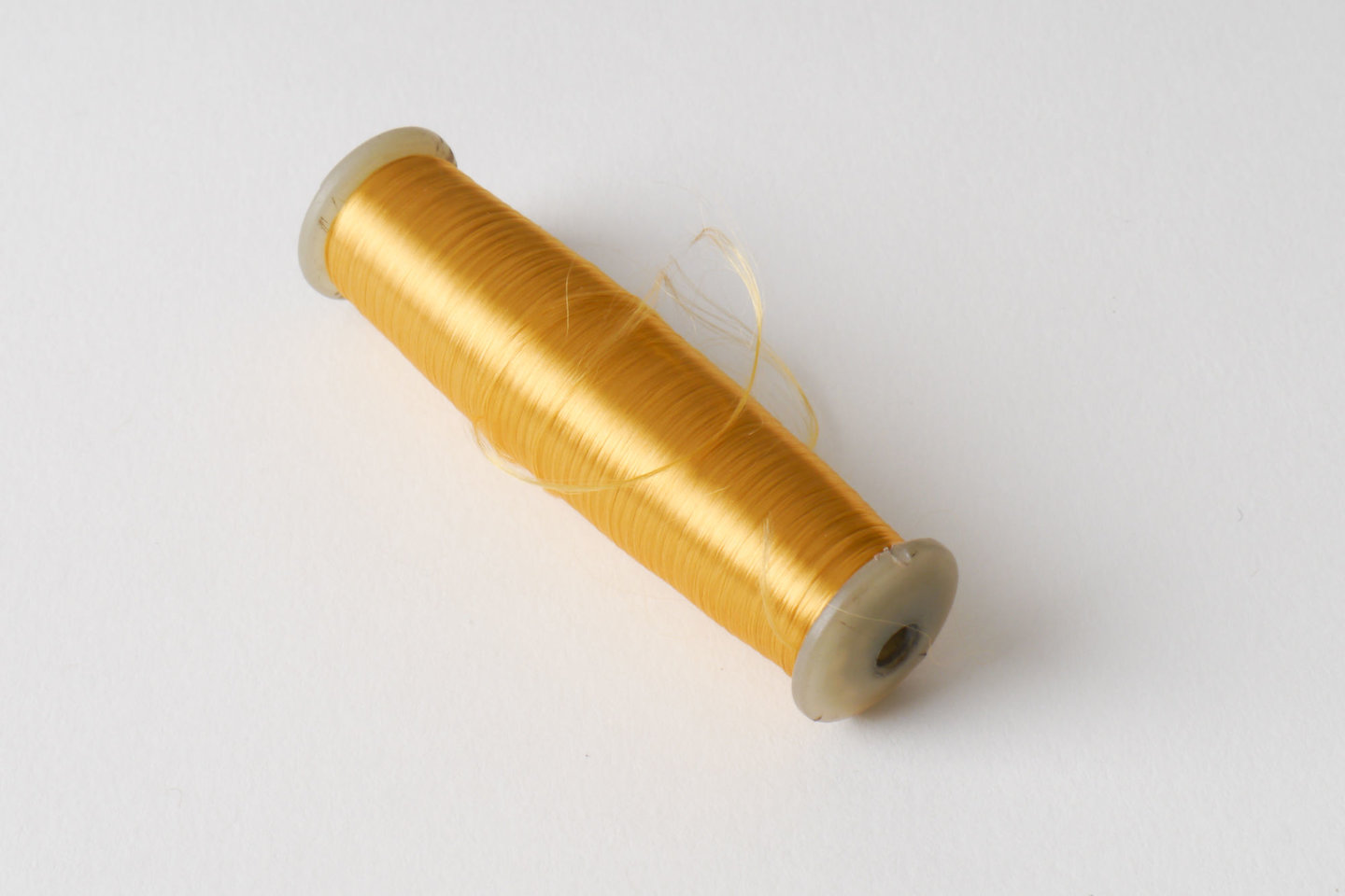 Spoel met inslaggaren voor passement