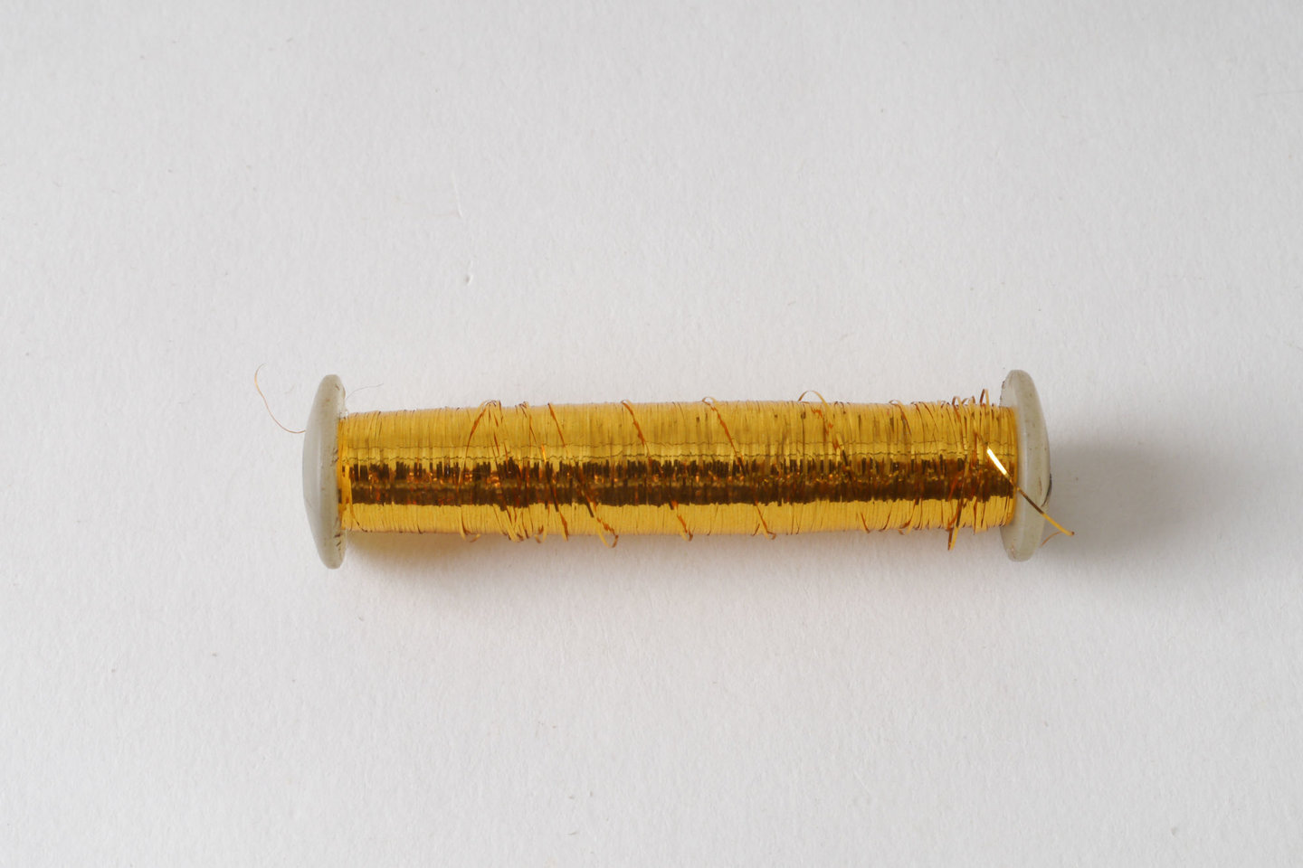 Spoel met inslaggaren voor passement