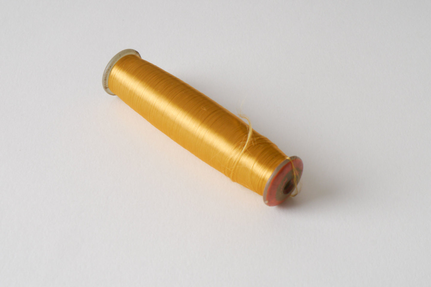 Spoel met inslaggaren voor passement