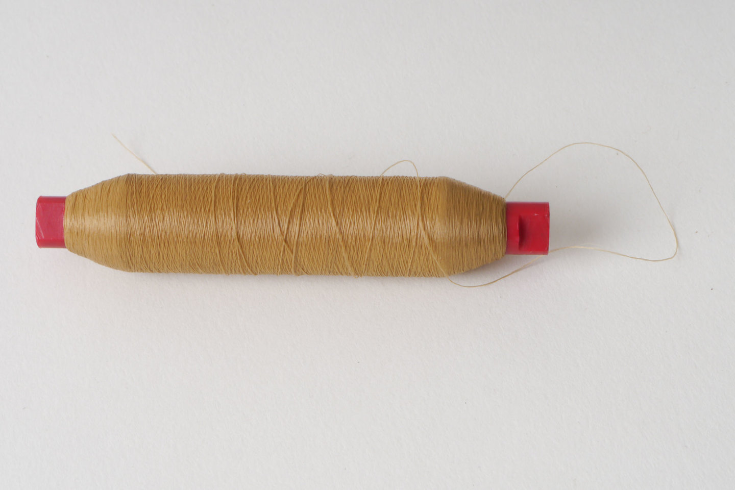 Spoel met inslaggaren voor passement