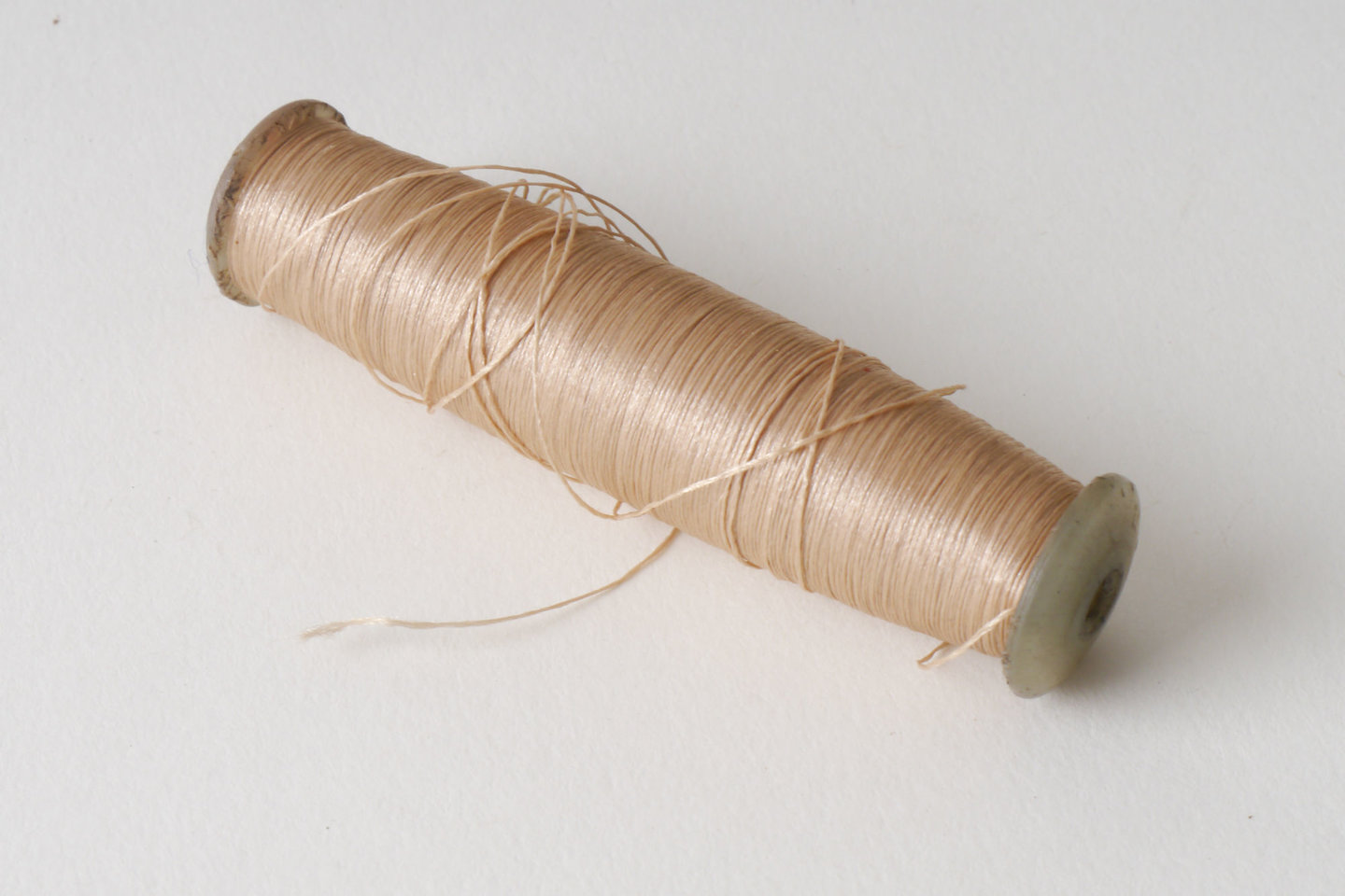 Spoel met inslaggaren voor passement