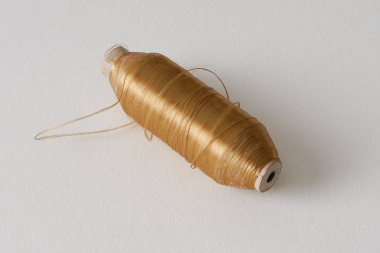 Spoel met inslaggaren voor passement