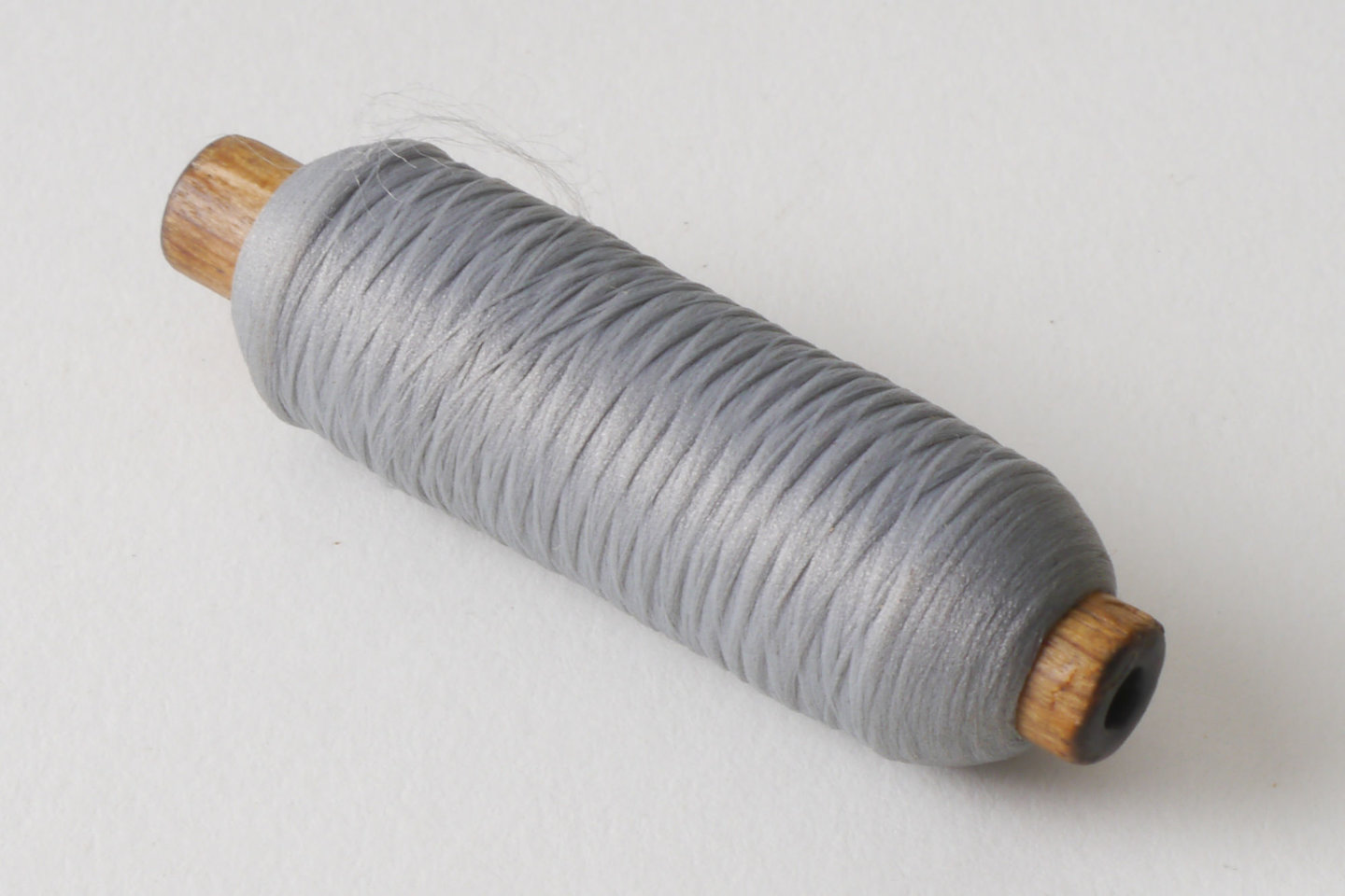 Spoel met inslaggaren voor passement