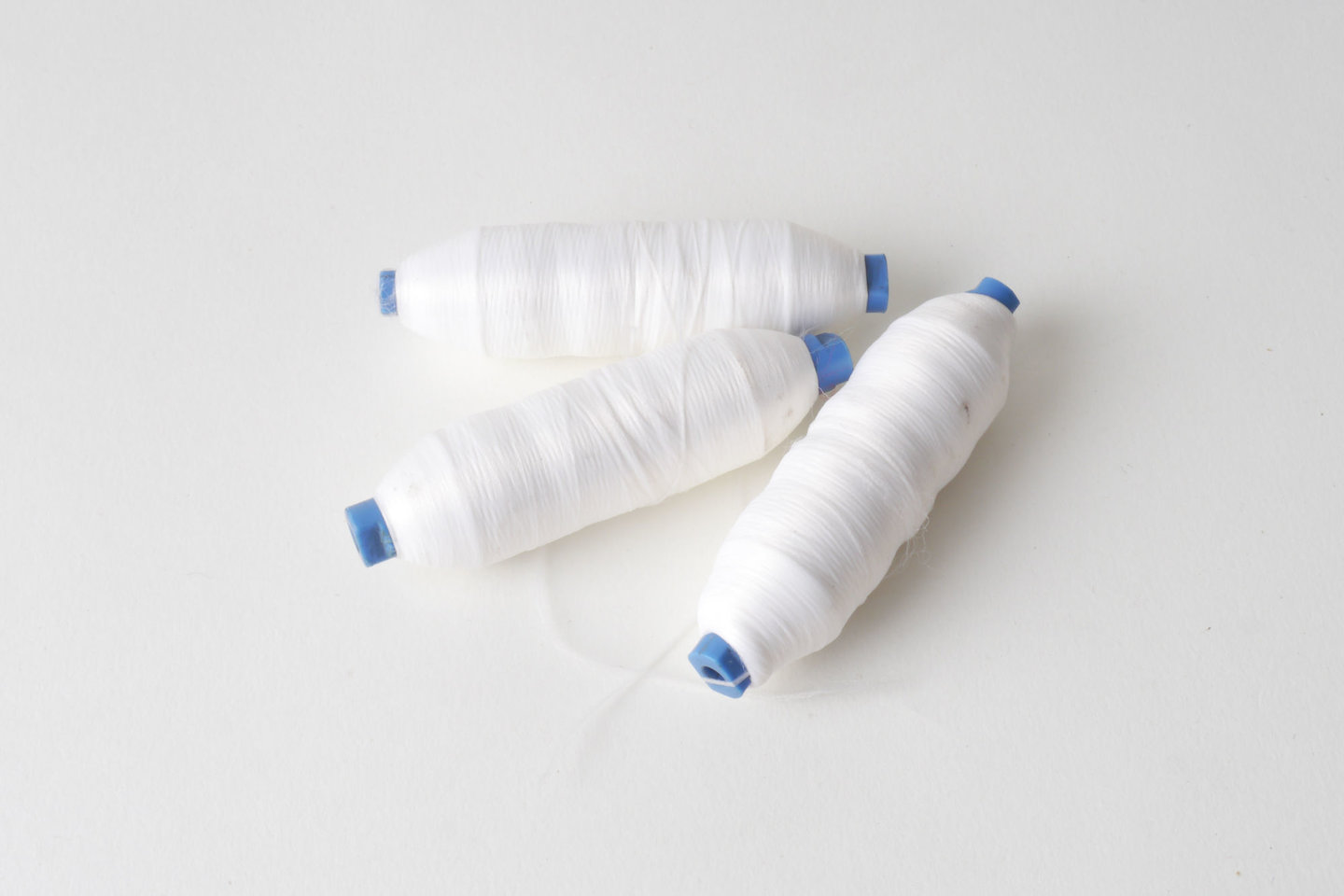 Spoel met inslaggaren voor passement