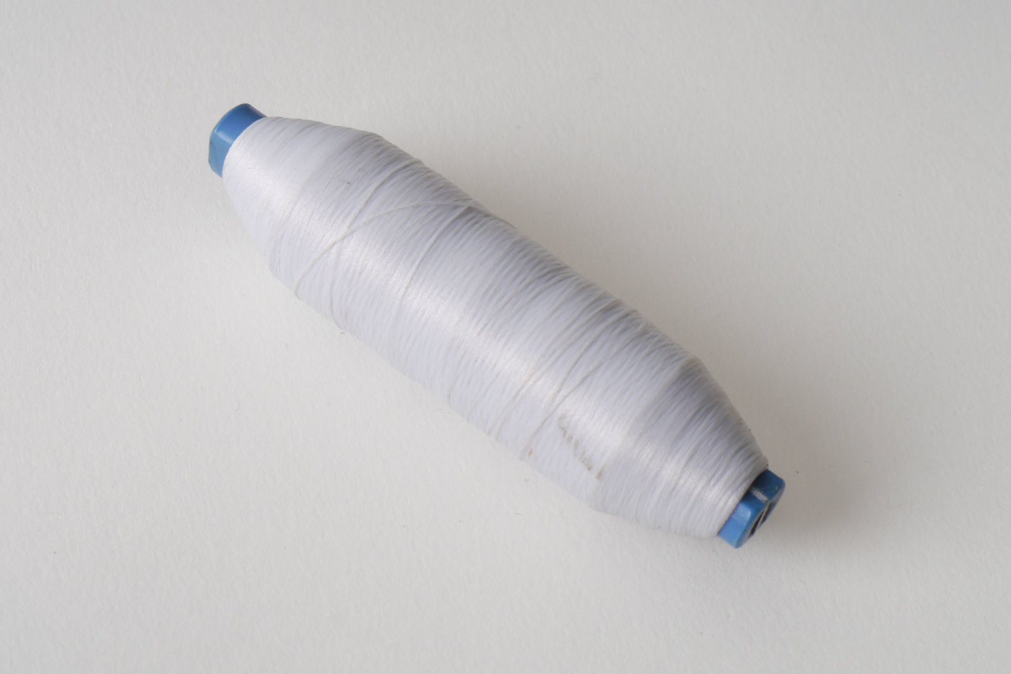 Spoel met inslaggaren voor passement