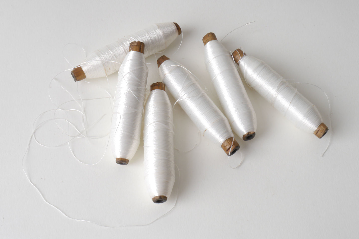 Spoel met inslaggaren voor passement