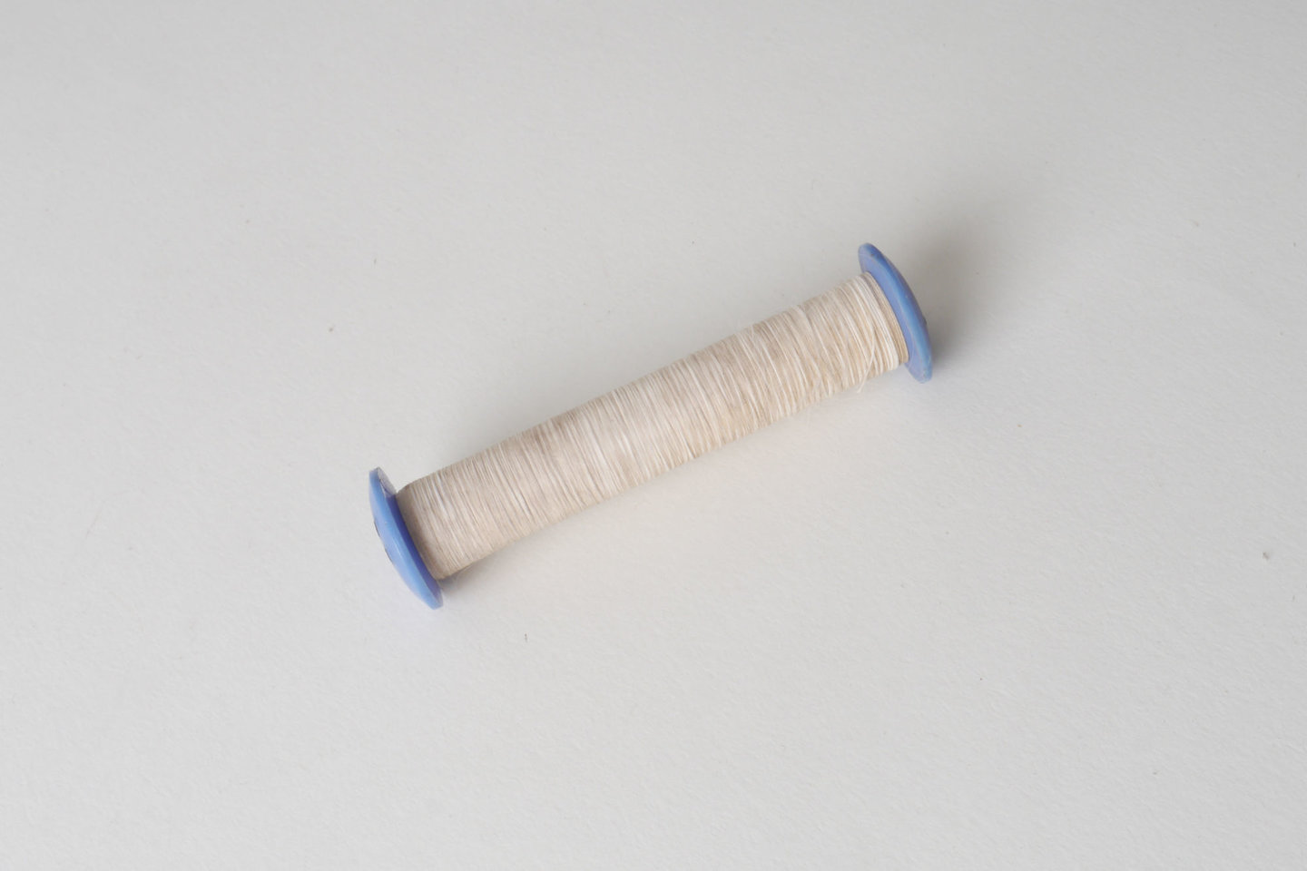 Spoel met inslaggaren voor passement