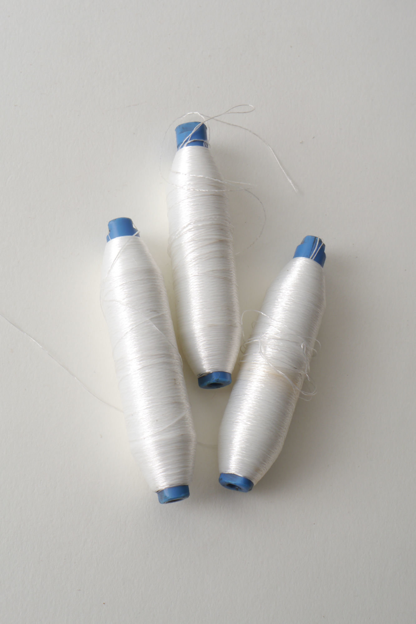 Spoel met inslaggaren voor passement