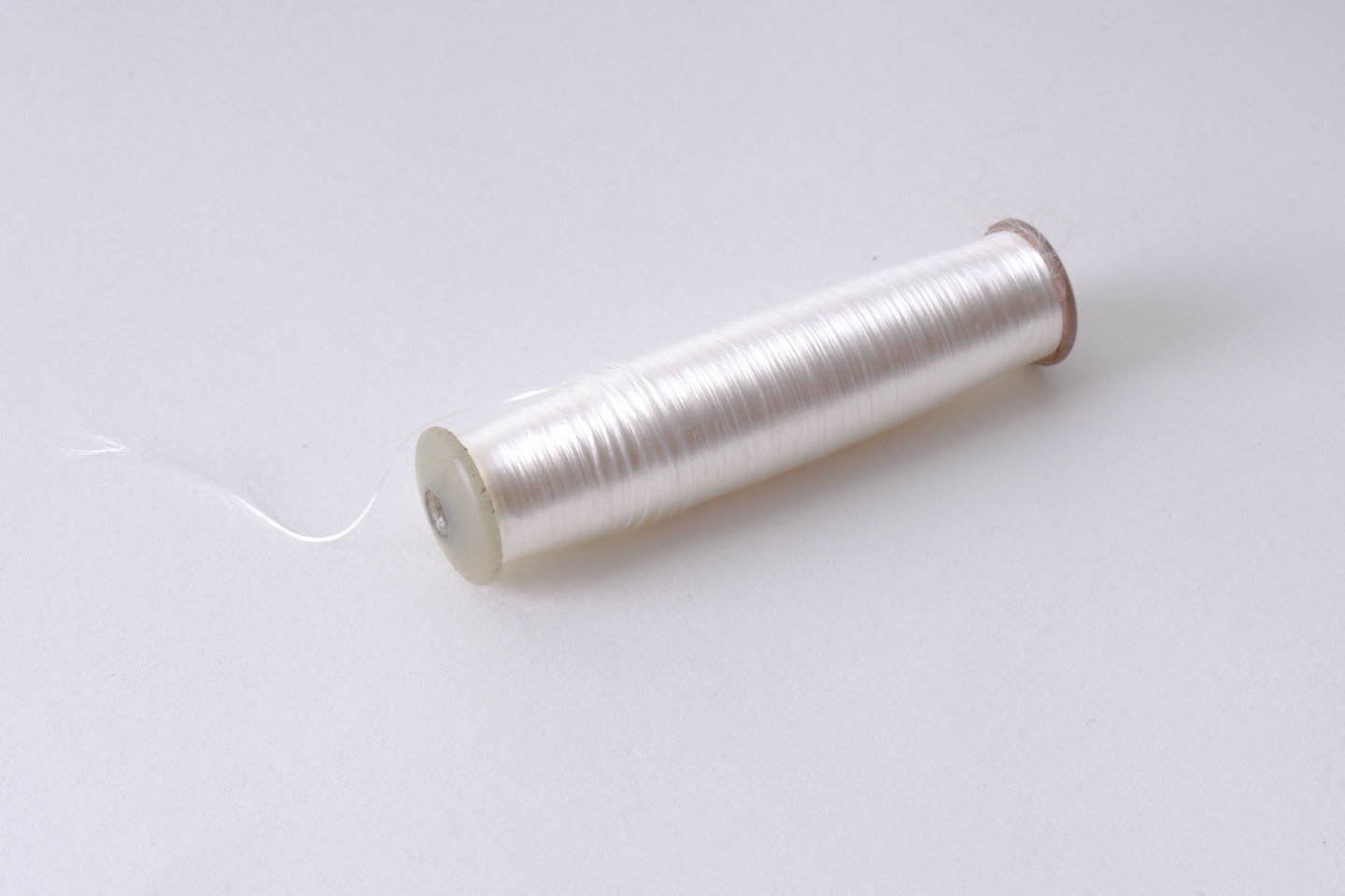 Spoel met inslaggaren voor passement