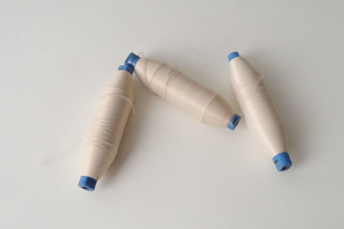 Spoel met inslaggaren voor passement